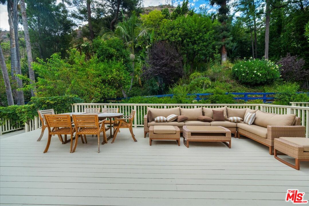 3479 Mandeville Canyon Road Los Angeles, CA 90049 - Photo 40 of 55 a view of a patio with couple of furniture