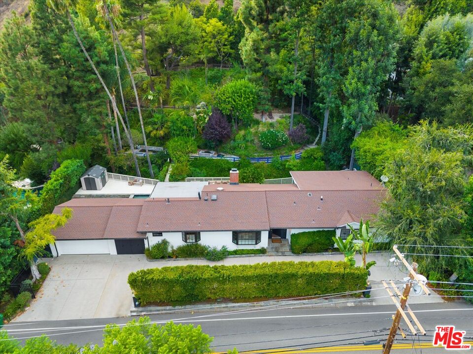 3479 Mandeville Canyon Road Los Angeles, CA 90049 - Photo 47 of 55 an aerial view of a house