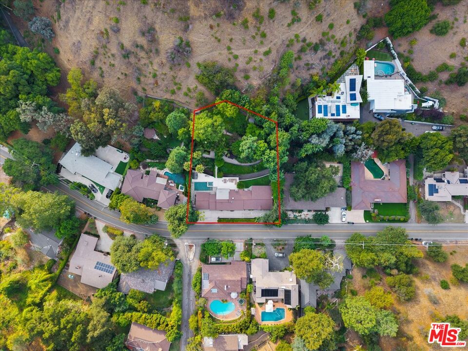 3479 Mandeville Canyon Road Los Angeles, CA 90049 - Photo 48 of 55 an aerial view of a house with a garden