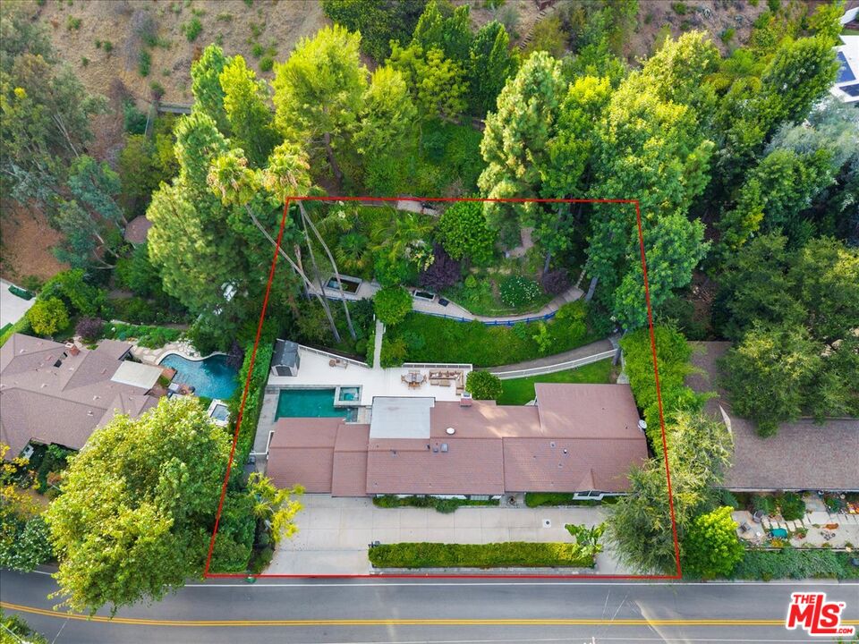 3479 Mandeville Canyon Road Los Angeles, CA 90049 - Photo 49 of 55 an aerial view of a house with a garden