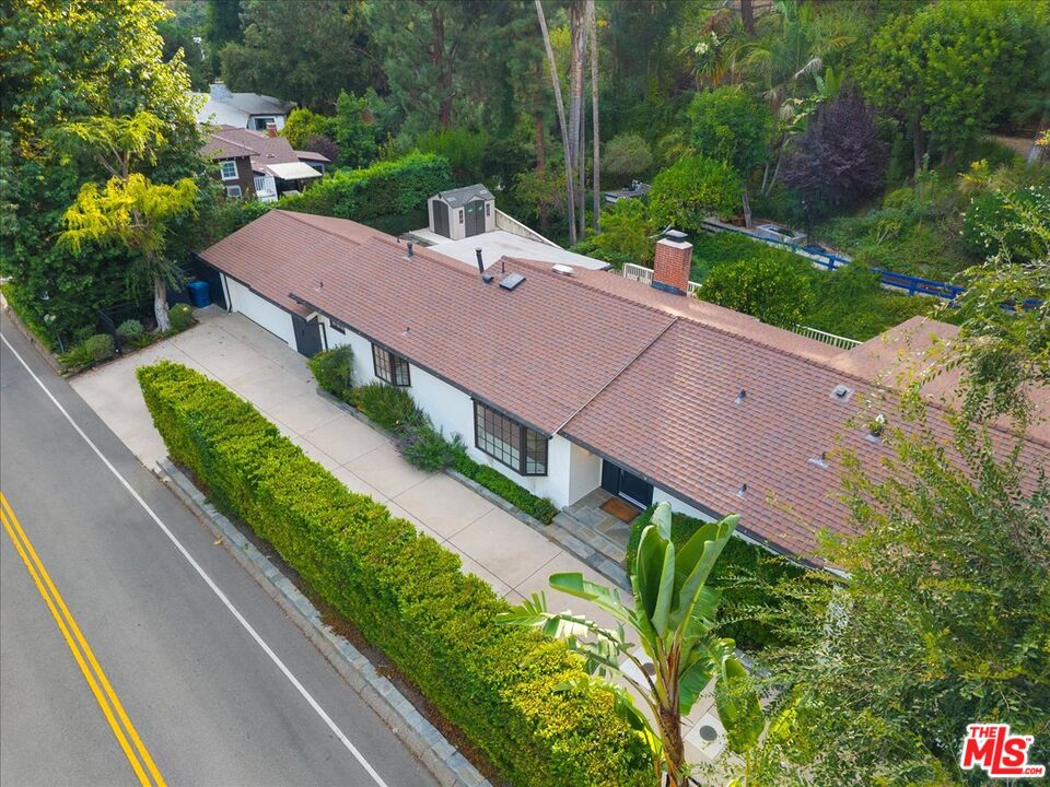 3479 Mandeville Canyon Road Los Angeles, CA 90049 - Photo 50 of 55 an aerial view of a house with a garden