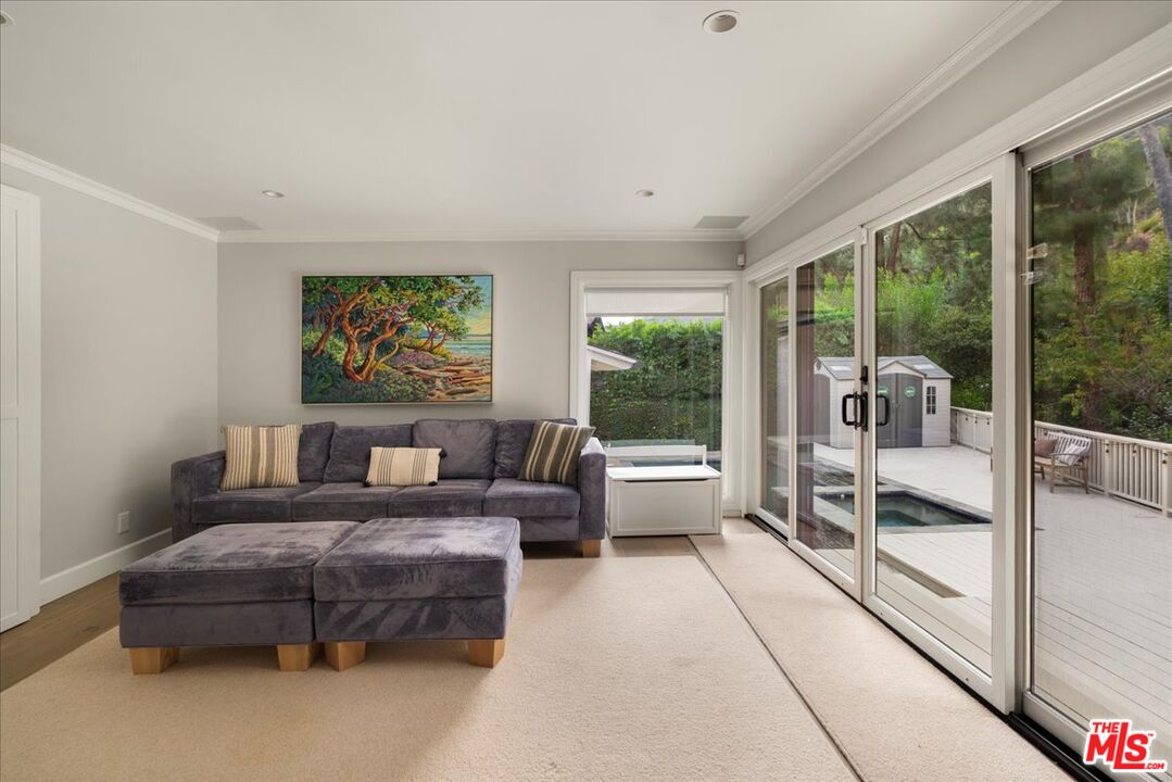 3479 Mandeville Canyon Road Los Angeles, CA 90049 - Photo 10 of 55 a living room with furniture