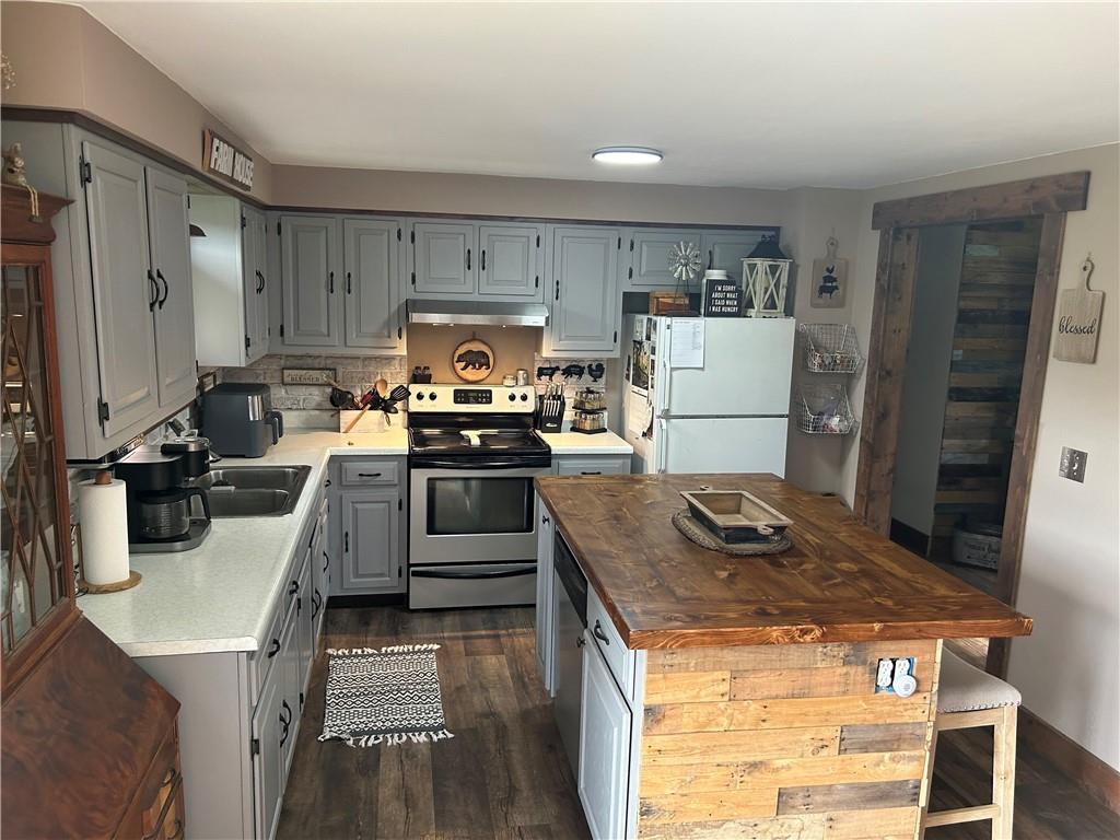 114 Howes Run Road Sarver, PA 16055 - Photo 12 of 33 a kitchen with a stove a refrigerator and a stove