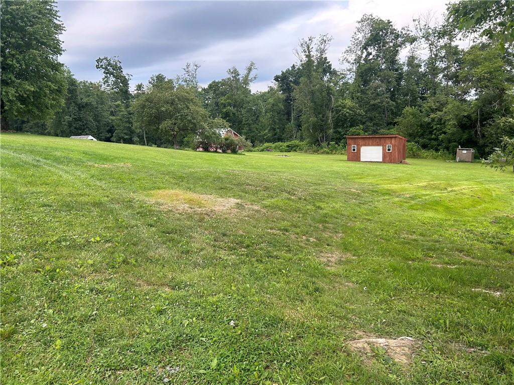 114 Howes Run Road Sarver, PA 16055 - Photo 16 of 33 a view of a green field with trees in the background