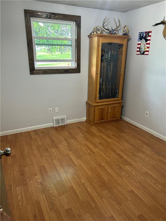 114 Howes Run Road Sarver, PA 16055 - Photo 24 of 33 an empty room with wooden floor and windows