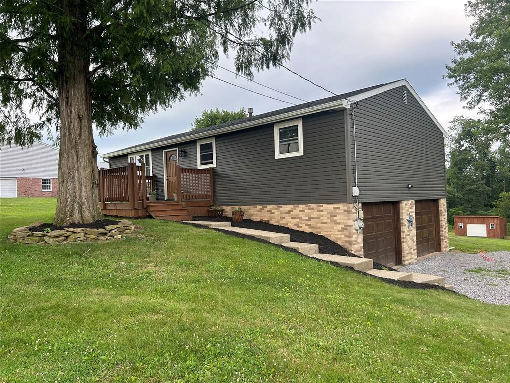 114 Howes Run Road Sarver, PA 16055 - Photo 3 of 33 a backyard of a house with wooden fence and large trees