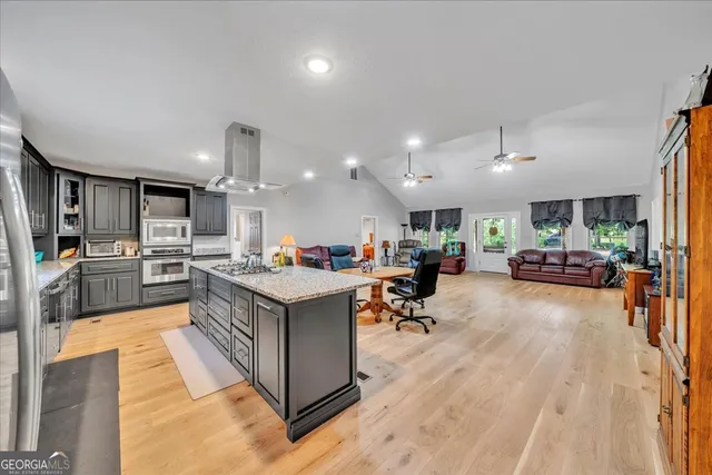 a kitchen with stainless steel appliances lots of counter top space