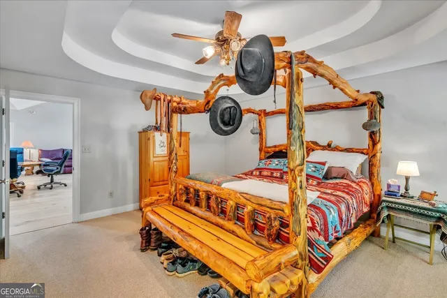 a bedroom with a bed and cabinets