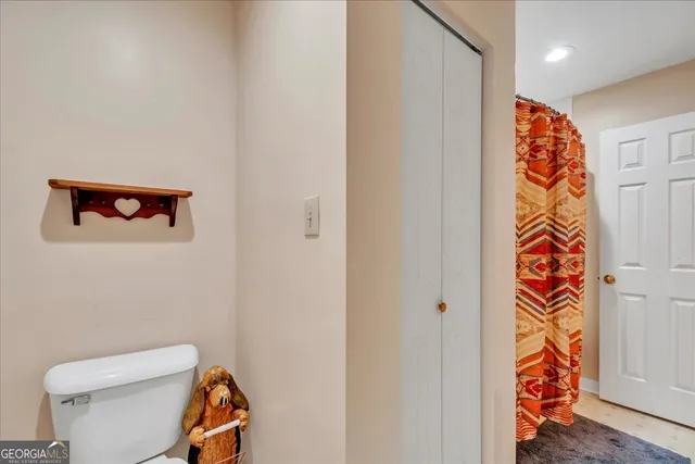 a view of balcony with wooden floor and outdoor seating