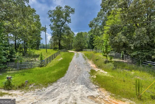 aerial view of a house with a yard