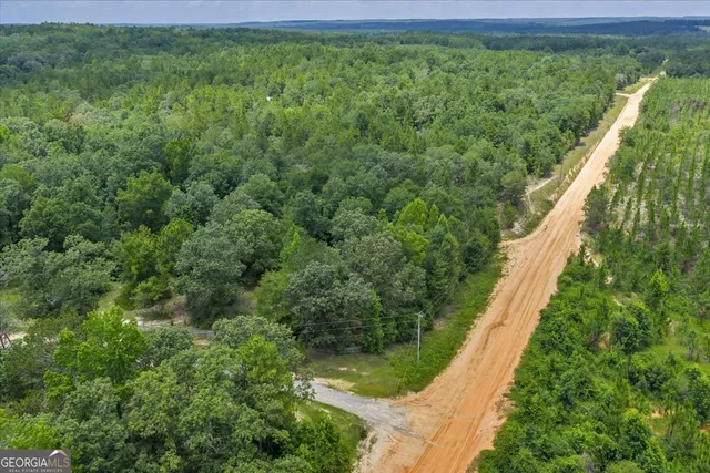 a view of a table and chairs in the garden