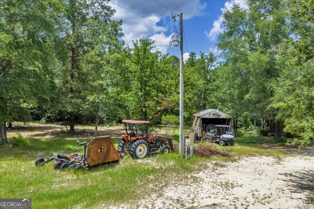 a view of a swimming pool with a yard