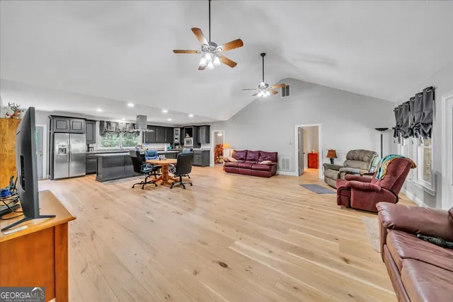 a view of a livingroom with furniture and a flat screen tv