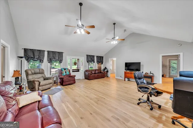 a view of a livingroom with workspace and a couch