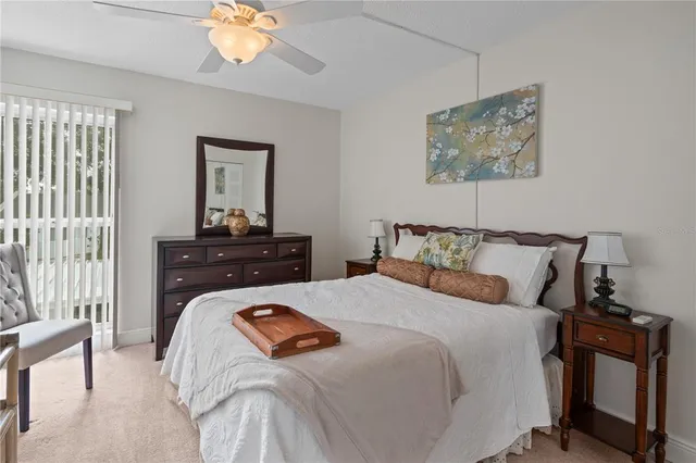 a bathroom with a granite countertop sink tub vanity and shower