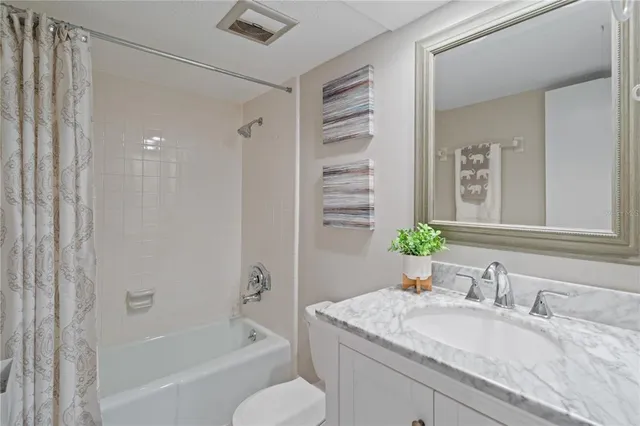 a view of a swimming pool with outdoor seating