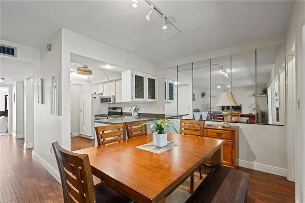 a view of a dining room with furniture window and outside view