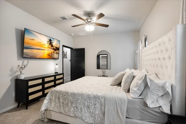 a spacious bathroom with a shower a sink and mirror