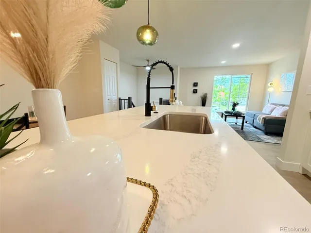 a bedroom with a bed a couch and dresser