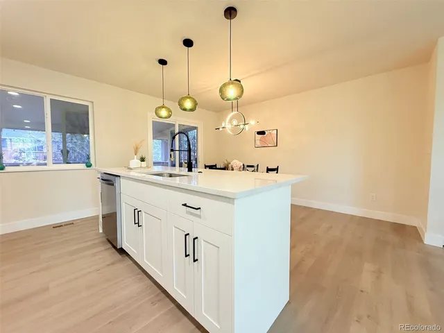 a bathroom with a sink vanity and a mirror
