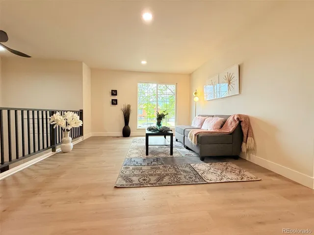 a living room with furniture and a rug