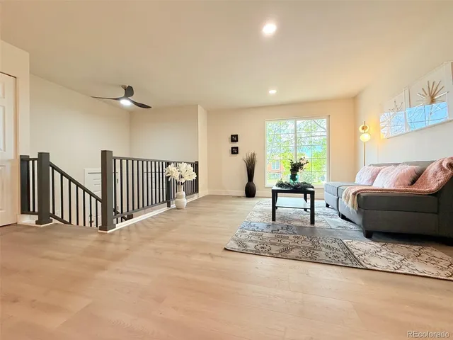 a living room with furniture and a rug