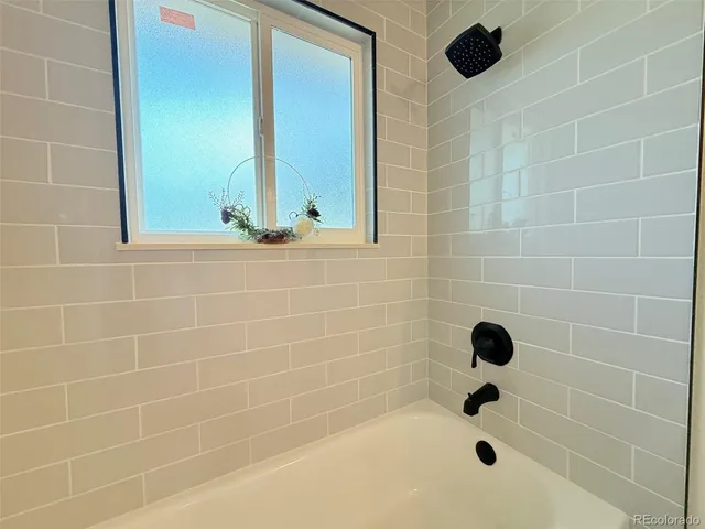 a bathroom with a shower and a bathtub
