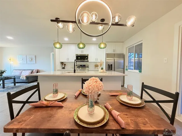 a living room with furniture and a mirror