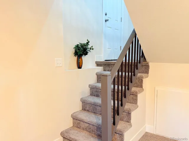 a view of an empty room with stairs