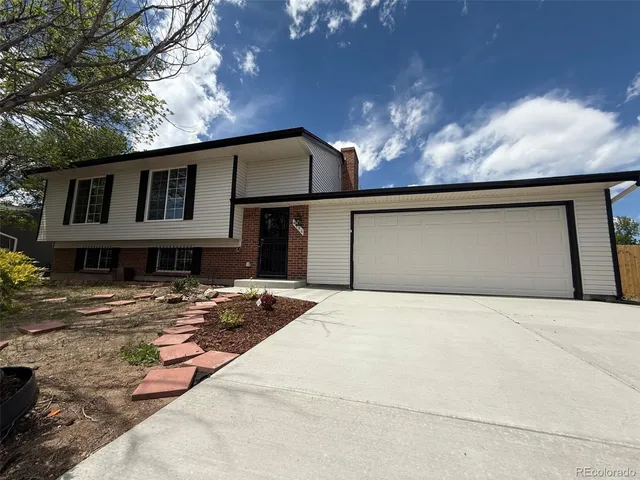 a front view of a house with yard
