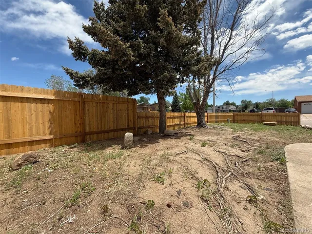 a backyard of a house with lots of green space