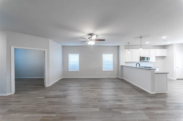 a view of a kitchen with a sink and a window