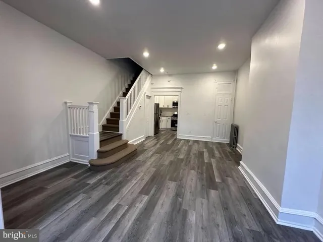 a view of entryway with wooden floor