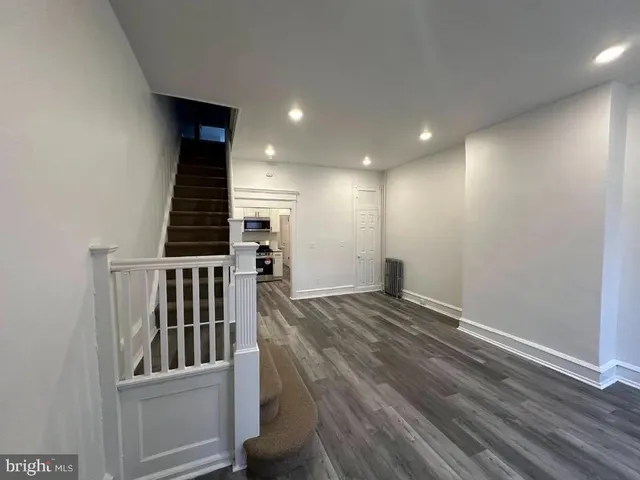 a view of entryway with wooden floor