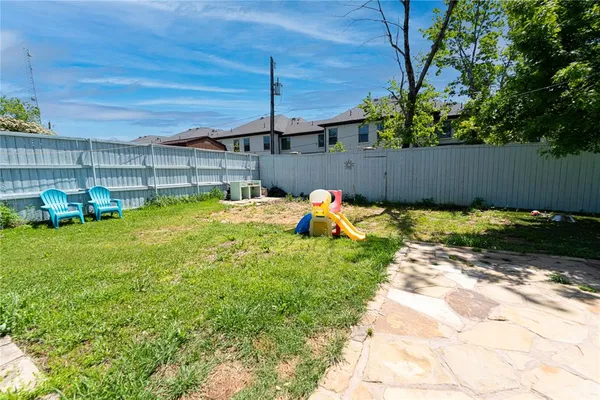 a view of a backyard with a patio