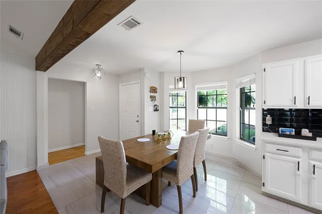 a view of a dining room with furniture