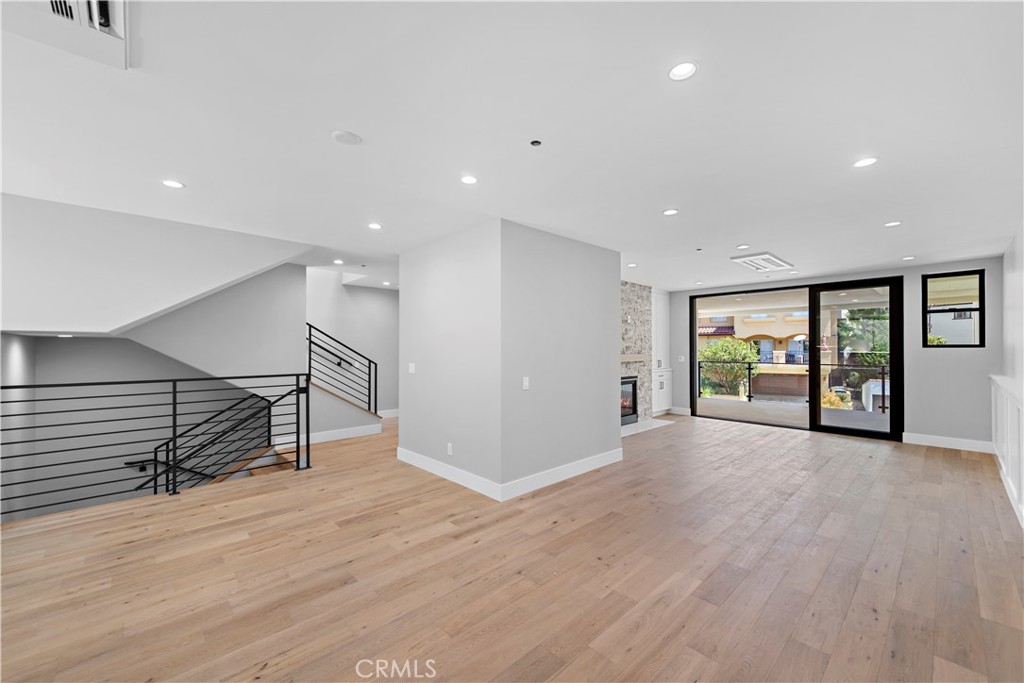 33901 Robles Drive Dana Point, CA 92629 - Photo 6 of 12 an empty room with wooden floor and windows