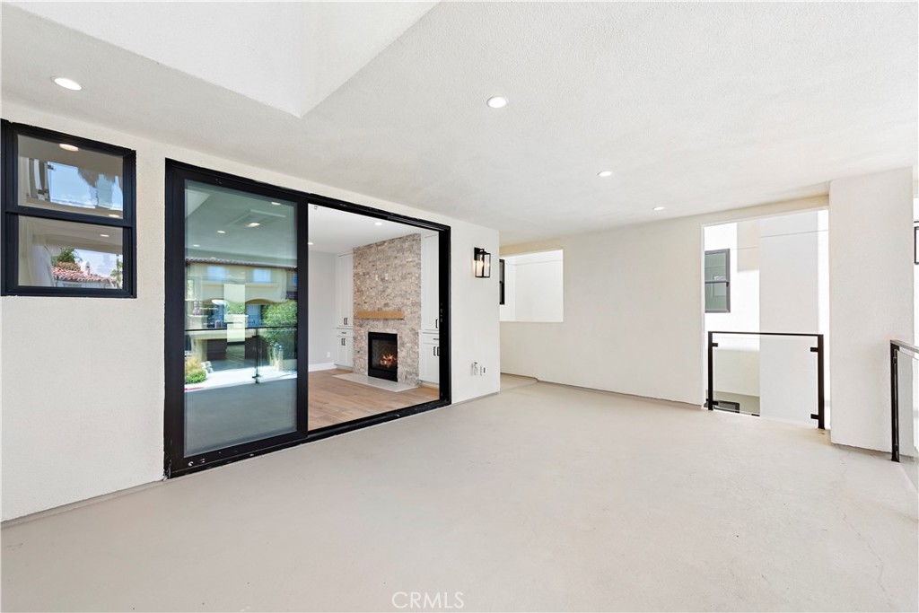 33901 Robles Drive Dana Point, CA 92629 - Photo 10 of 12 an empty room with entrance and windows