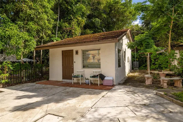 a backyard of a house with seating space