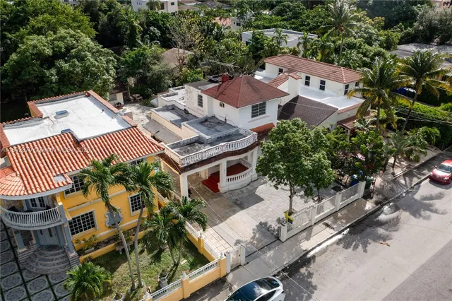 an aerial view of a house with a garden