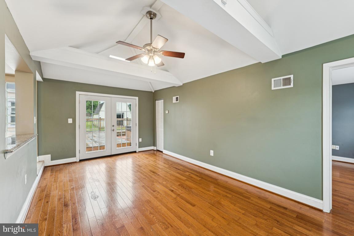 5 Brookfield Road Pasadena, MD 21122 - Photo 13 of 34 a view of an empty room with wooden floor
