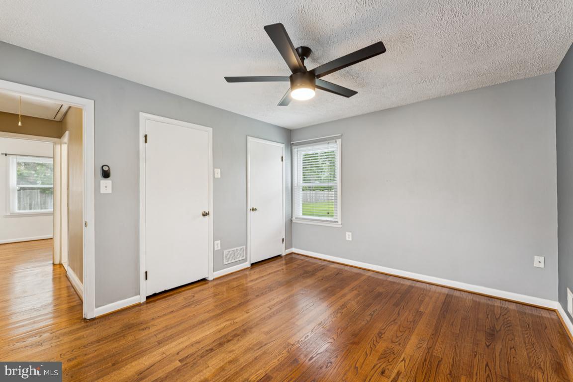 5 Brookfield Road Pasadena, MD 21122 - Photo 17 of 34 wooden floor in an empty room with a window