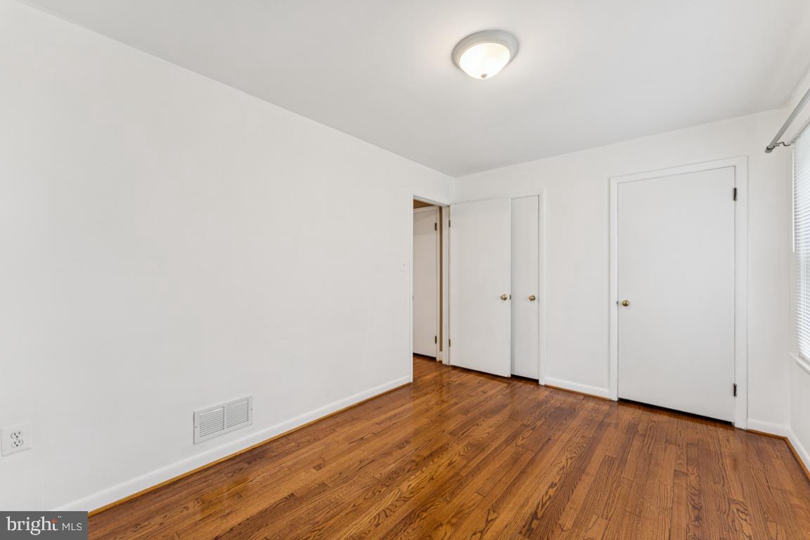 5 Brookfield Road Pasadena, MD 21122 - Photo 20 of 34 a view of an empty room with wooden floor