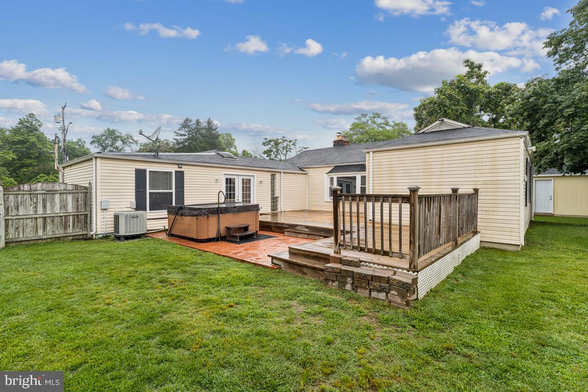5 Brookfield Road Pasadena, MD 21122 - Photo 22 of 34 a view of a house with backyard and deck