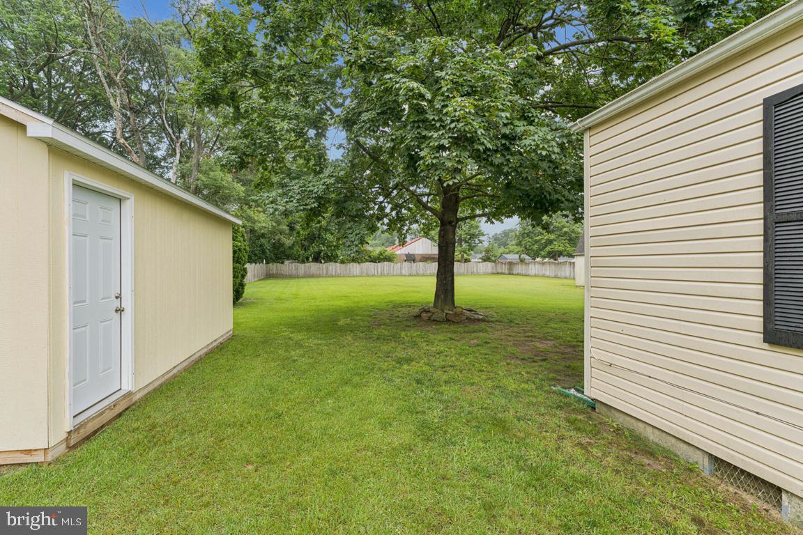 5 Brookfield Road Pasadena, MD 21122 - Photo 25 of 34 a view of a backyard with a trees