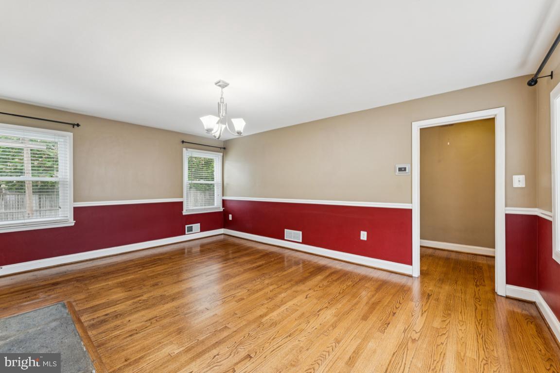 5 Brookfield Road Pasadena, MD 21122 - Photo 9 of 34 a view of empty room with wooden floor and fan
