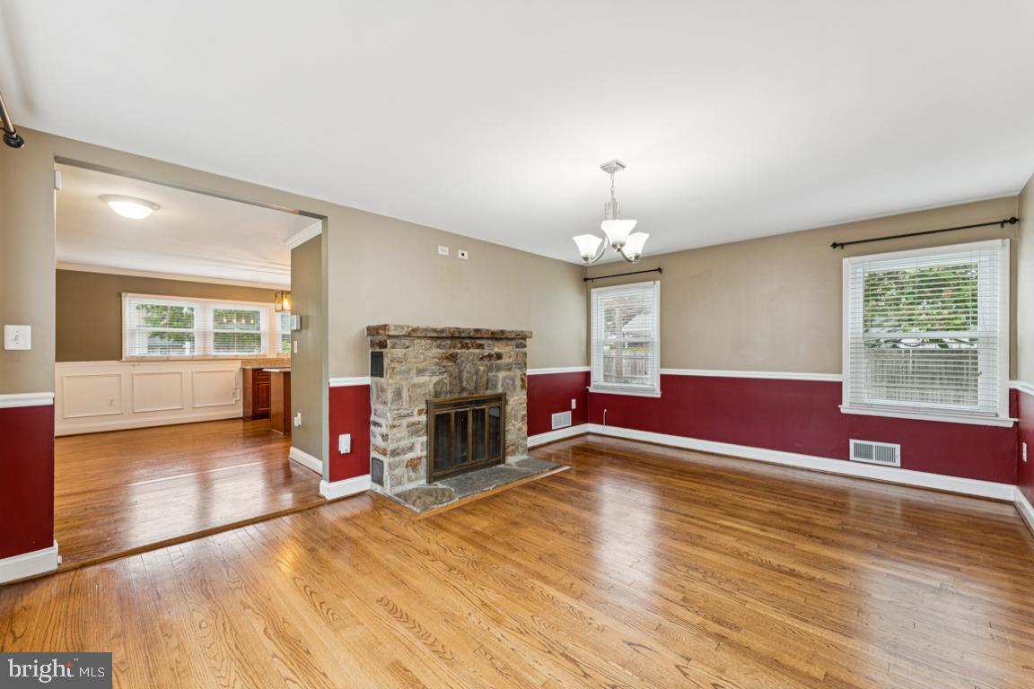 5 Brookfield Road Pasadena, MD 21122 - Photo 10 of 34 a living room with furniture and a fireplace