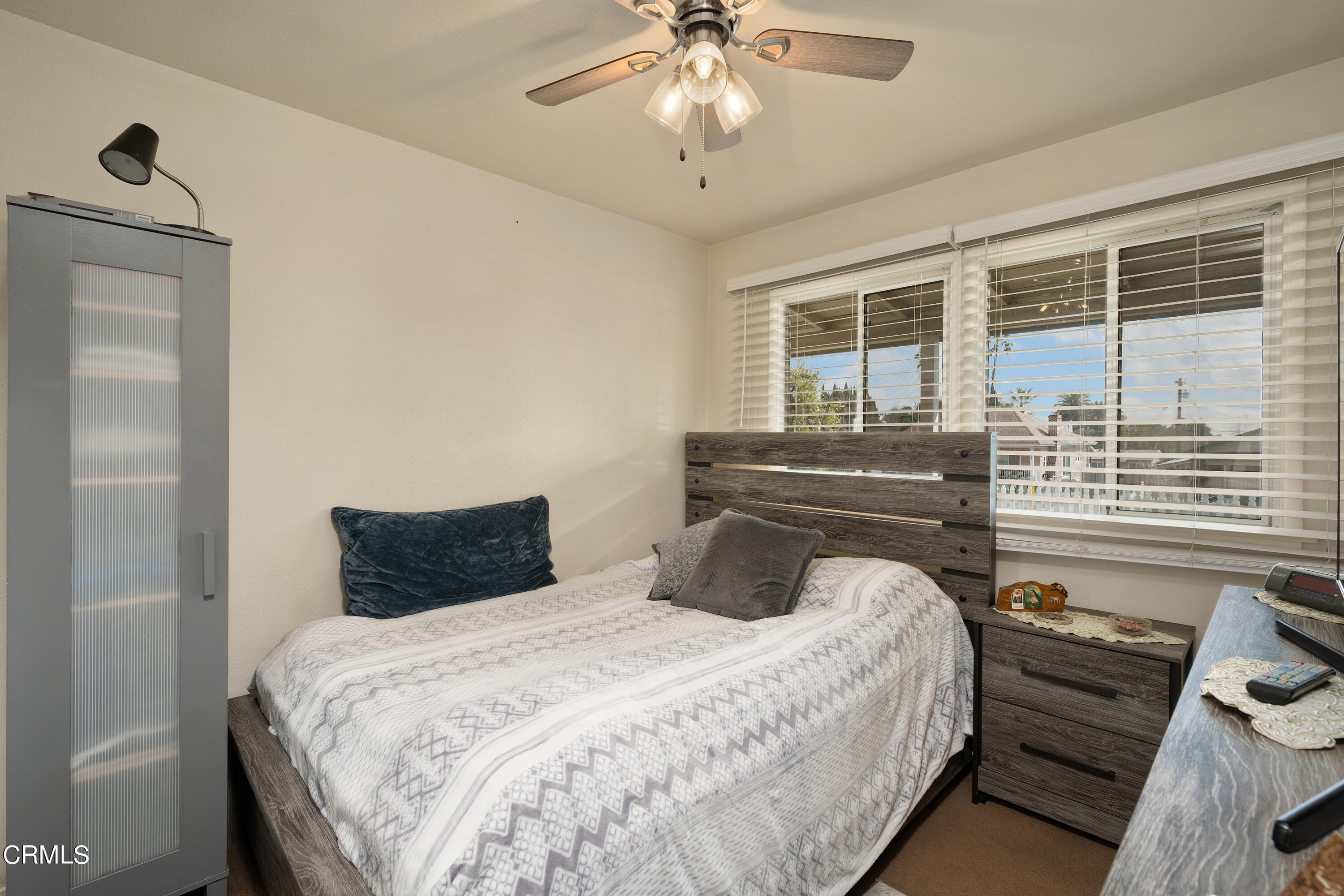 1761 Atchison Street Pasadena, CA 91104 - Photo 11 of 30 a bedroom with a bed and a chandelier