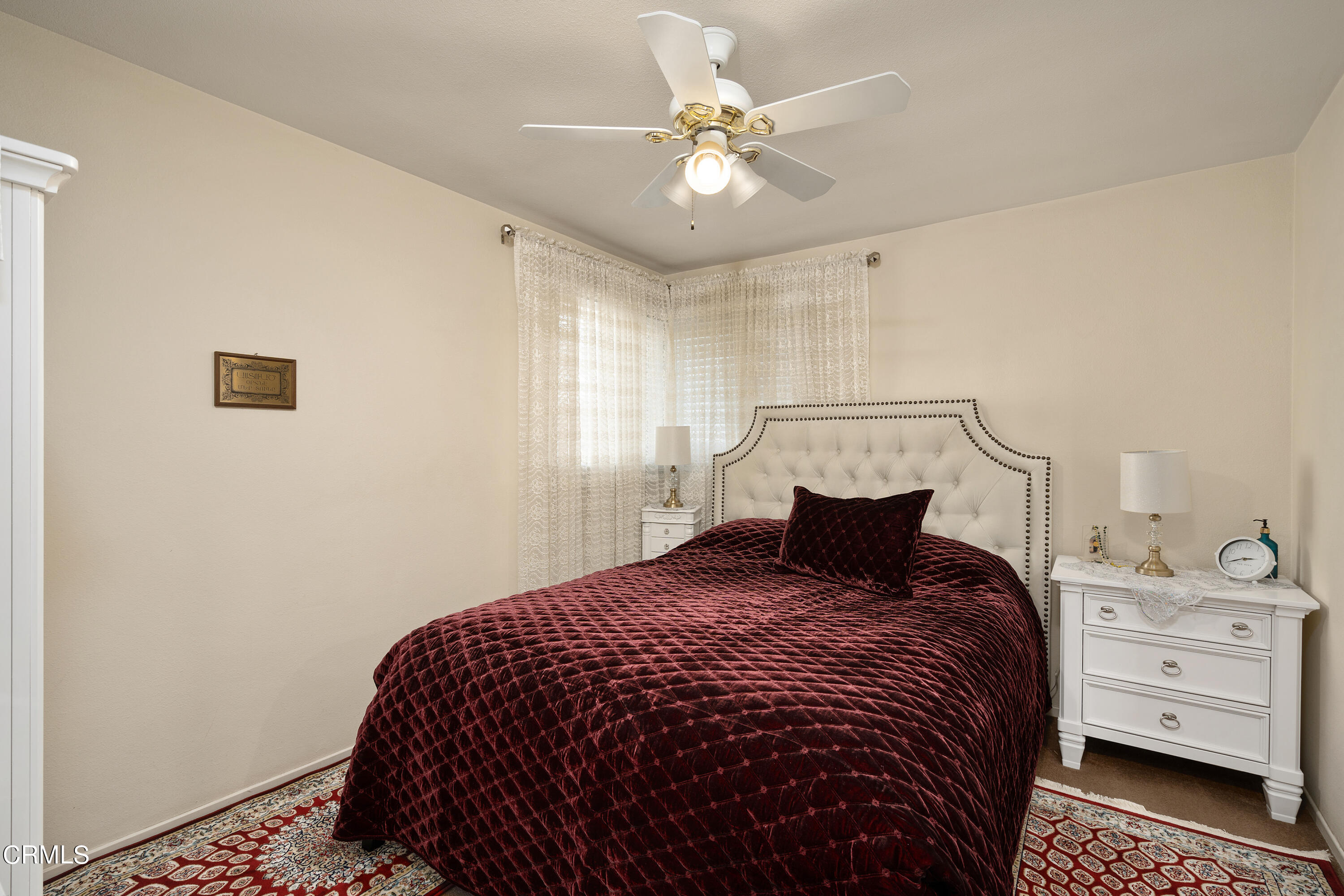 1761 Atchison Street Pasadena, CA 91104 - Photo 12 of 30 a bedroom with a bed and a chandelier