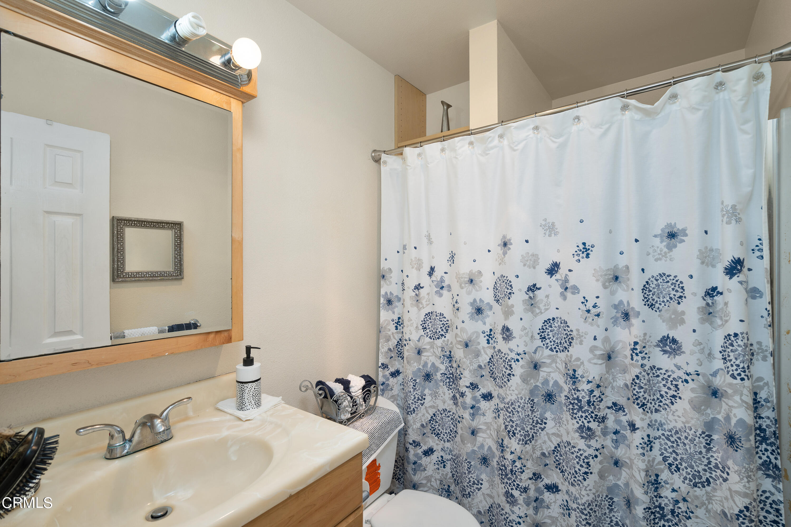 1761 Atchison Street Pasadena, CA 91104 - Photo 13 of 30 a bathroom with a sink toilet and mirror